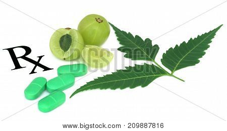 Amla fruits and green tablets prescribed as alternative medicine
