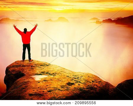 Hiker Watching To Autumn  Sun At Horizon . Beautiful Moment The Miracle Of Nature. Colorful Mist In