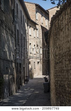 Urbino (Marches Italy): historic buildings at morning: alley
