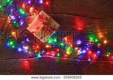 Christmas rustic background - vintage planked wood with lights and free text space.