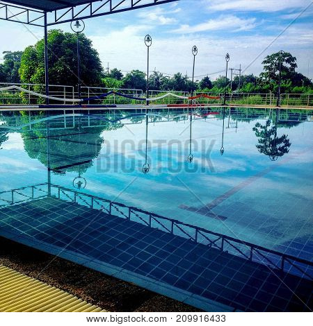 Reflex shadow swimming pool with great nature view.
