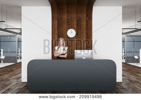 Front view of reception desk with cheerful female worker in modern office interior. 3D Rebdering