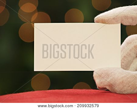 Santa Claus holding a blank placard background.