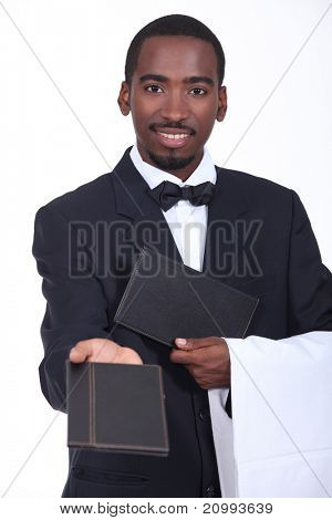 Waiter offering a menu