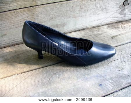 Shoe On Wood Deck