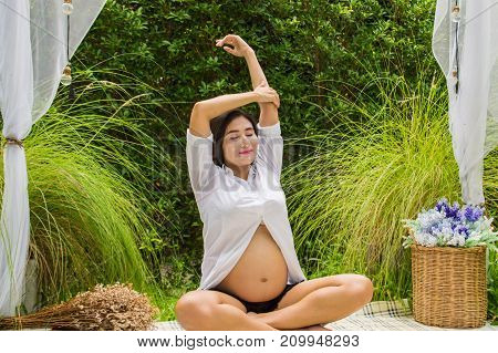 Abdominal women are taking care of their health with yoga.