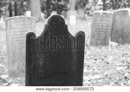 Old tombstones in a colonial cemetery in Metuchen New Jersey. This cemetery predates the Revolutionary War.
