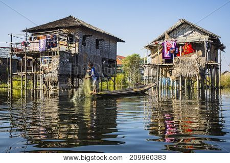 Inle Lake, Myanmar-February 11 2017: Local boy fishing in a traditional village named Nampan located in Inle lake,Myanmar.