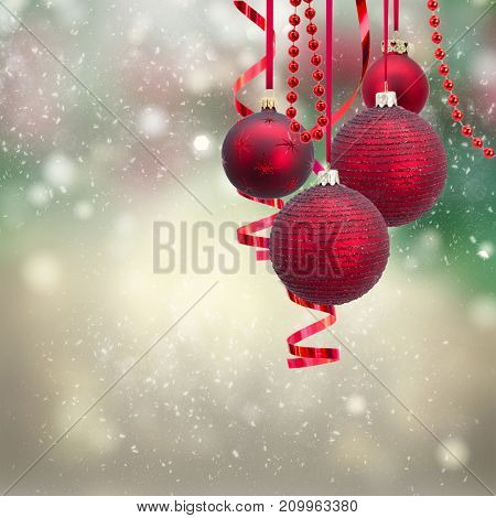 Red christmas balls and evergreen fir tree on gray winter background
