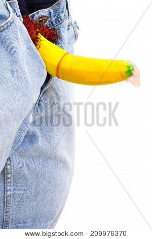 A Big Banana Sticks Out Of A Blue Jean Demonstraiting A Penis With A Piece Of Condom