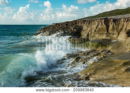 Waves crashing on shore at Blowing Rocks Preserve beach in Hobe Sound Florida