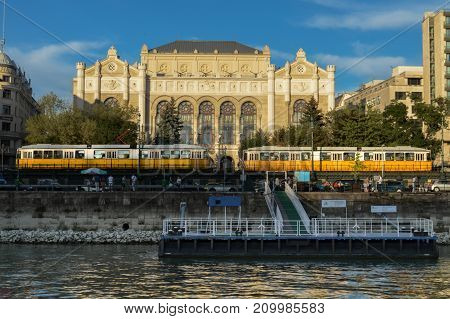 2 trams are stay in front of the Vigado Concert Hall, Budapest, Hungary