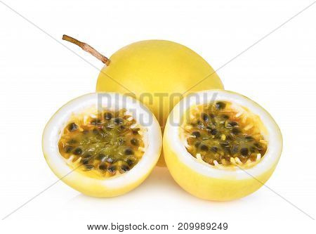 whole and half of passion fruit isolated on white background