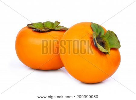 two whole of fresh ripe persimmons isolated on white background