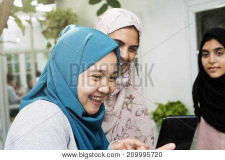 Group of students using mobile phone
