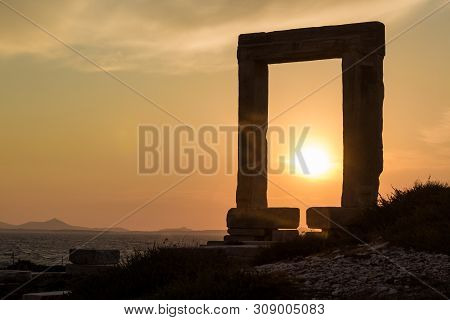 Sunset At The Portara In Naxos, Aegean In Greece