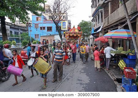 Howrah, West Bengal , India - July 22th 2018 : Drummers Playing Drums At Rath Jatra Festival, While 