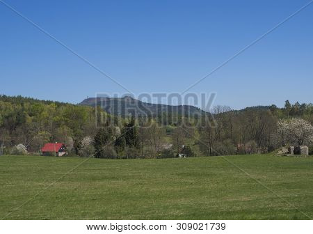Spring Landscape With View On Village Marenice In Lusitian Mountains With Traditional Wooden Cottage