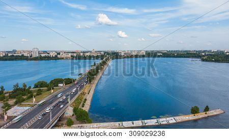 Aerial Hyperlapse Video With View Of Bridge, Cars Moving Fast On A Bridge On A Sunny Day
