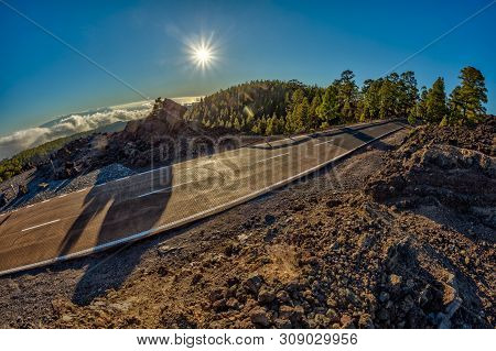 Fish Eye Lens Shot Of Sunset Time Above The Clouds In The Mountains. Fresh Lava Fields. Park Road Cr