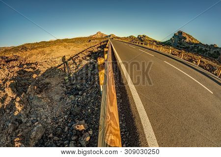 Fish Eye Lens Shot Of Sunset Time Above The Clouds In The Mountains. Fresh Lava Fields. Park Road Th