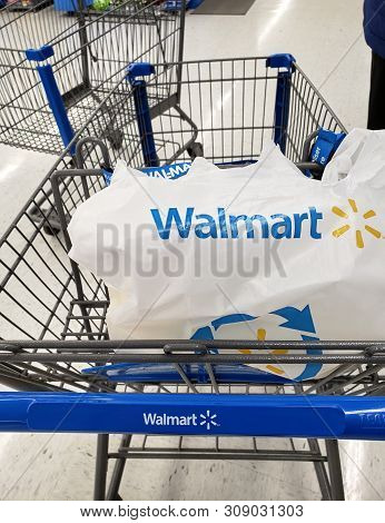 Montreal, Canada - April 30, 2019: Branded Walmart Shopping Cart And Bag In Walmart Store. Walmart I