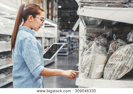 Asian Woman Worker Working With Digital Tablet Checking Boxes Logistic Import And Export Supplies Pa