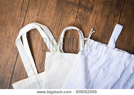 Tote Canvas Fabric Eco Bag Cloth Shopping Sack On Wooden Background / Zero Waste Use Less Plastic Sa