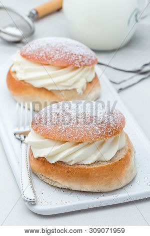 Traditional Swedish Dessert Semla, Also Called Shrove Bun, With Almond Paste And Whipped Cream Filli