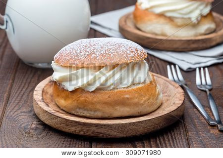 Traditional Swedish Dessert Semla, Also Called Shrove Bun, With Almond Paste And Whipped Cream Filli