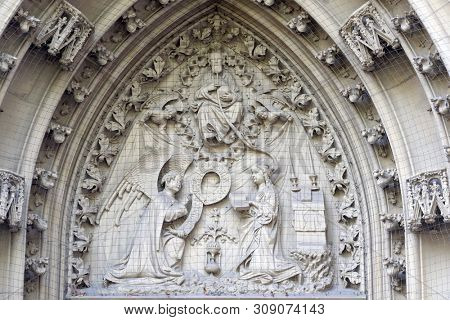 WURZBURG, GERMANY - JULY O4, 2018: The tympanum shows the Annunciation to Mary, portal of the Marienkapelle in Wurzburg, Bavaria, Germany