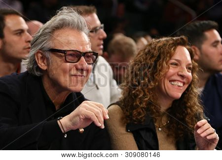 NEW YORK - FEB 10: Harvey Keitel (L) and wife Daphna Kastner attend the game between the New York Knicks and the Los Angeles Clippers at Madison Square Garden on February 10, 2013 in New York City.