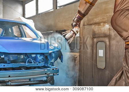 Production Line Of Automobile Plant, Paint Shop. Car Body After Applying The Base Paint.