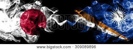 Japan Vs Marshall Islands Smoky Mystic Flags Placed Side By Side. Thick Colored Silky Smokes Combina