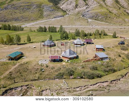 Aerial View Of A Settlement In The Altai Mountains With Small Houses For Indigenous People And Touri