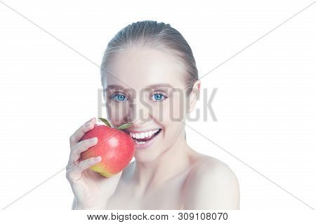 Portrait Of Happy Smiling Young Beautiful Woman Eating Red Apple, Over White Background