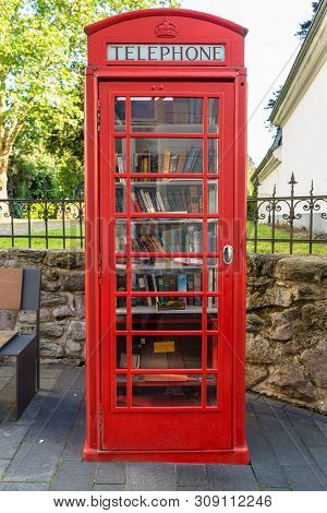 Konigswinter, Germany - 23 May 2019. A Red Telephone Booth For The Free Exchange Of Books.