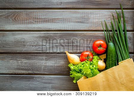 Buying Fresh Vegetables In Paper Bag On Wooden Background Top View Copyspace