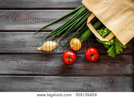 Buying Fresh Vegetables In Paper Bag On Wooden Background Top View Copyspace