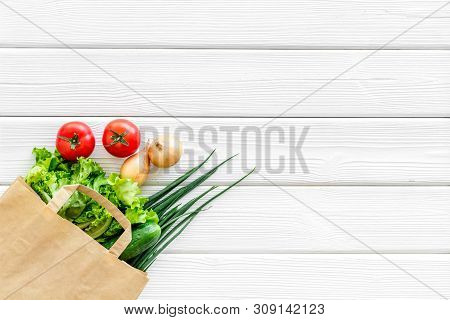 Buying Fresh Vegetables In Paper Bag On White Wooden Background Top View Copyspace