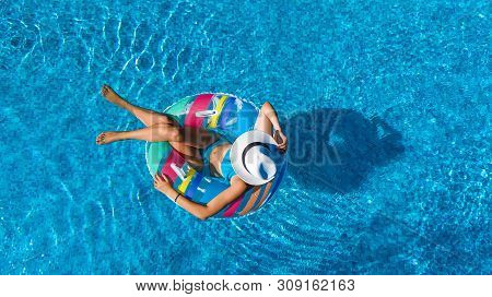 Beautiful Girl In Hat In Swimming Pool Aerial Top View From Above, Young Woman Relaxes And Swims On 