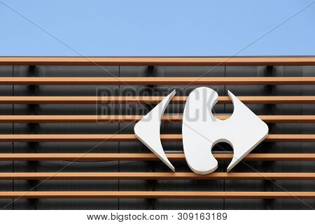 Saint Egreve, France - June 16, 2019: Carrefour Sign On A Wall. Carrefour Is A French Multinational 