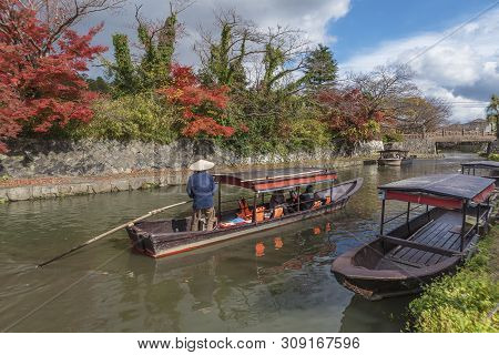 Tourist On Boat Sightseeing Around Hachiman-bori Canal In Omihachiman, Japan