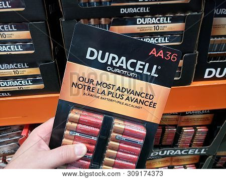Montreal, Canada - June 20, 2019: A Hand Holding Duracell Quantum Batteries Pack. Duracell Is Americ
