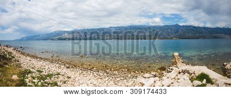 Old Stone Pier On The Adriatic Coast. Sea Coast Of Croatia. Calm Water. Beautiful Places Of European