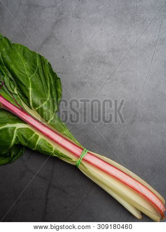 Creative Layout Made Of Mangold. Flat Lay. Food Concept. Mangold On The Concrete Background. Cellulo