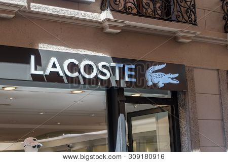 Lugano, Switzerland - June 1, 2019: Logo And Sign Of Lacoste. Lacoste Is A French Company, Founded I
