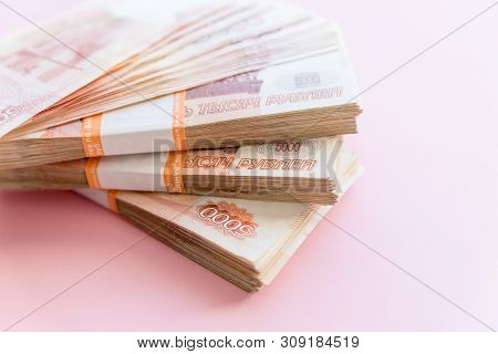Russian Rubles Isolated On Pink, Packed Stack Of Banknotes.russian Money 5000 Rubles Banknote Closeu