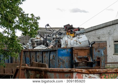Metal Scrap Is Located In Large Containers