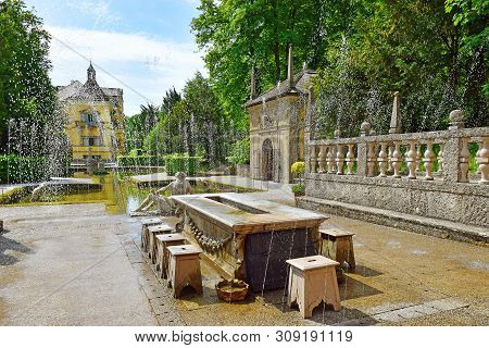 Salzburg, Austria - May 25, 2019 : Trick Fountains Hidden In A Dinner Table And Sculptures At The Po